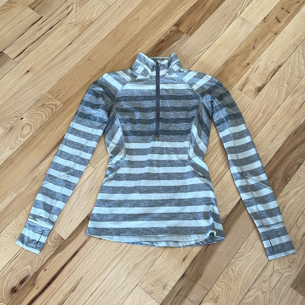 Lululemon half-zip.  Tags missing - but fits like a 2.